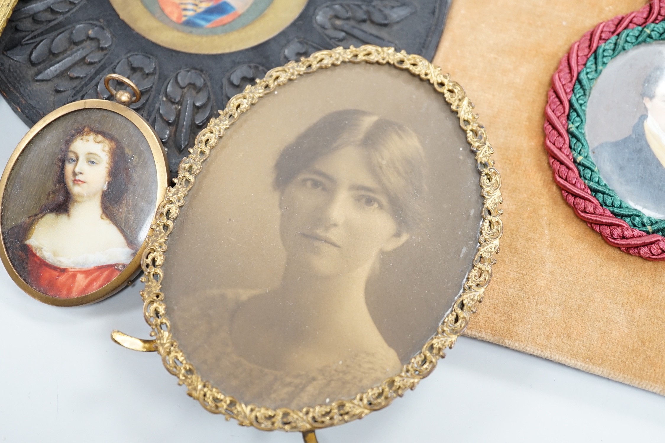 Continental School, 18th century, portrait miniature on ivory, Portrait of a Lady in a red dress, together with six other portraits. To include the subject of military interest: a portrait watercolour of General Isaac Br